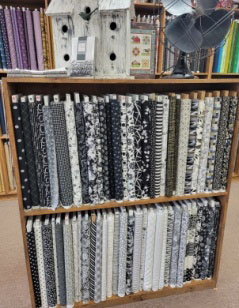 Shelves of black and white fabric