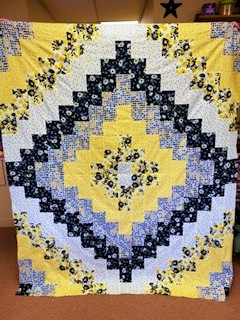Quilt made using brickyard quilt pattern and cottage cloth fabric