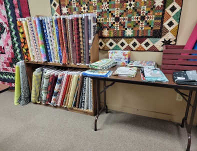 Picture of sale room with sale fabrics and samples